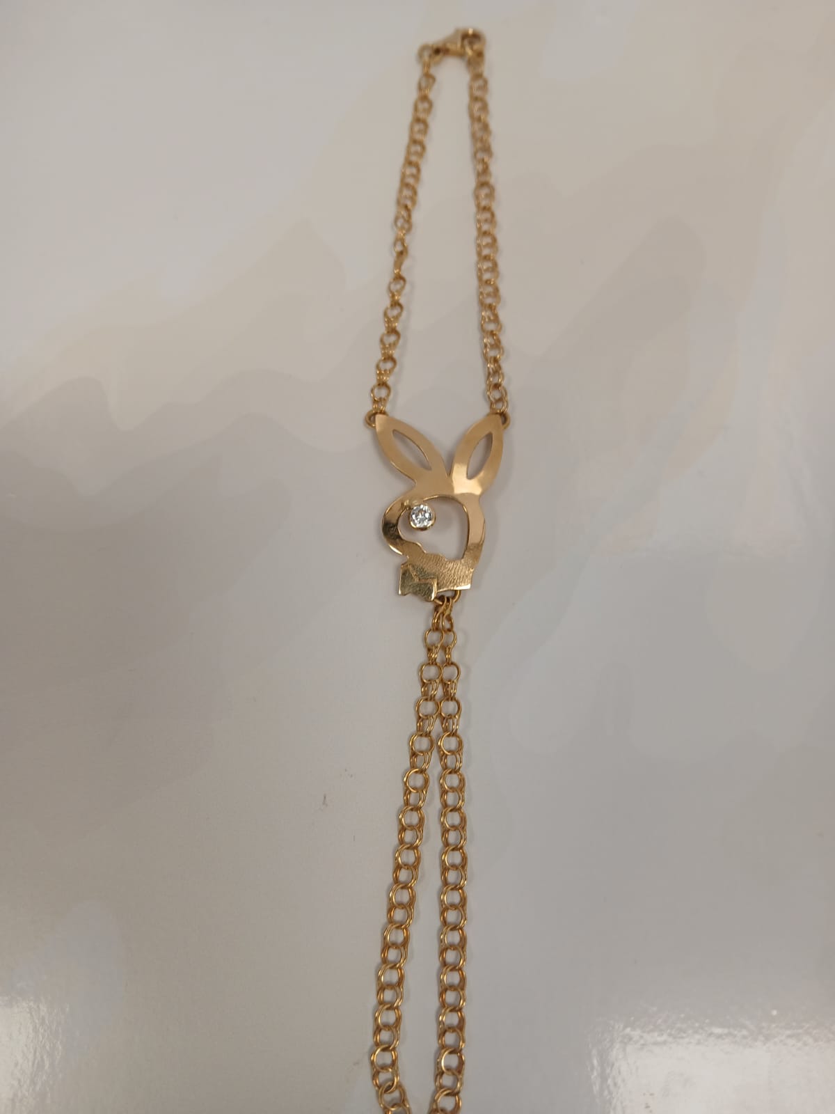 Pulsera manita Playboy en Oro 18Kl con circonita